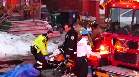 Fireman doing chest compression during CPR with paramedics Stock Footage 48669406