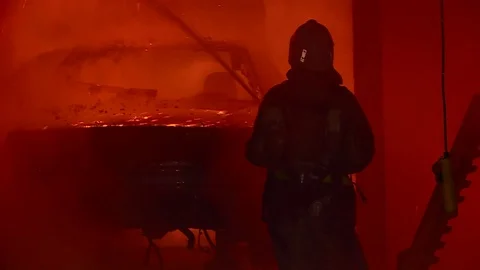 The fireman extinguishes fire in building. Burning car. 스톡 동영상 72888936