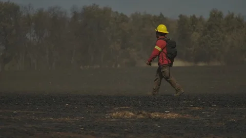 Fireman in the fields Stock Footage 125040284