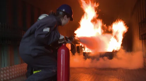 FIREMAN FIGHTING EXTINGUISHER 2 Stock Footage 39380090