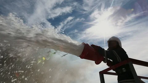 Fireman fighting a fire with heavy smoke frames at a factory storage 스톡 동영상 93190903