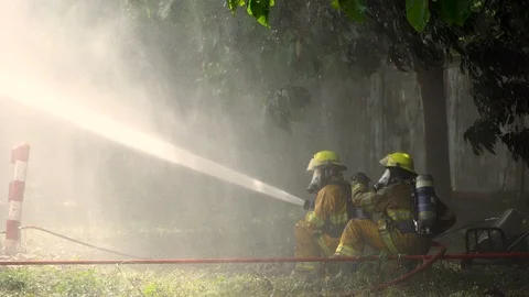 Fireman on the fire Stock Footage 99784659
