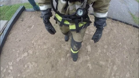 The fireman in the gas mask rises on the retractable ladder. Fire protection. Stock Footage 79489973