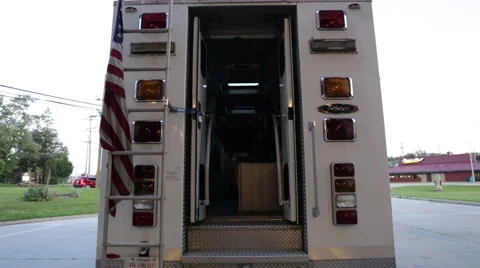 Fireman getting an axe from inside the fire engine Stock Footage 66548787