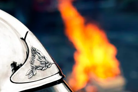 Fireman helmet with flame Stock Photos