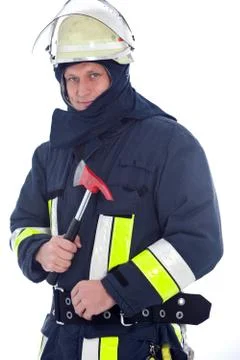 Fireman holding a red fire axe Stock Photos