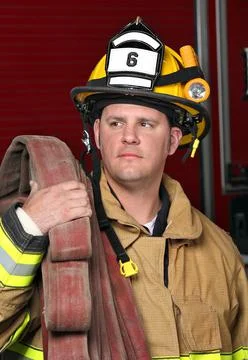 Fireman with hose close up Stock Photos