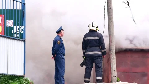 The fireman looking at a blazing fire. Stock Footage 109388734