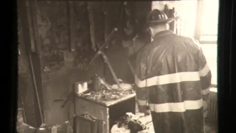 Fireman Moves Amid Building Fire Around Burned Ruins Stock Footage 130177706