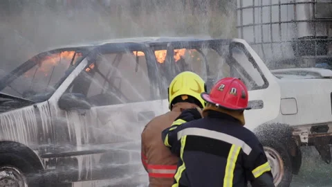 A firefighter operates a water hose during the Major Accident