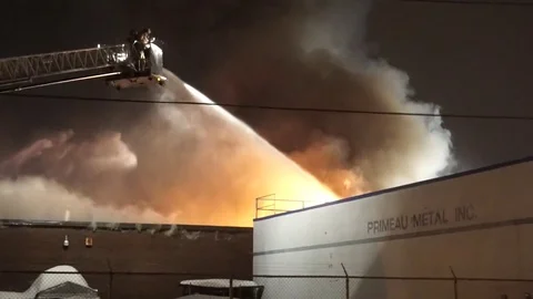 Fireman in a plateform fighting flames Stock Footage 85252635