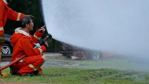 Fireman prepare equipment at fire engine truck Stockbeeldmateriaal 276348215