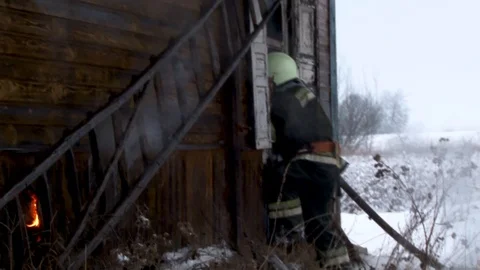 Fireman puts out burning house.. Belarus/Oshmyany/18 December 2018 Stock Footage 100530412