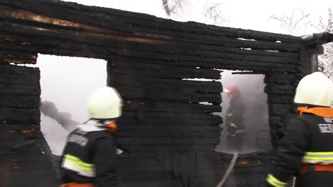 Fireman puts out burning house.. Belarus/Oshmyany/18 December 2018 Stock Footage 100530625
