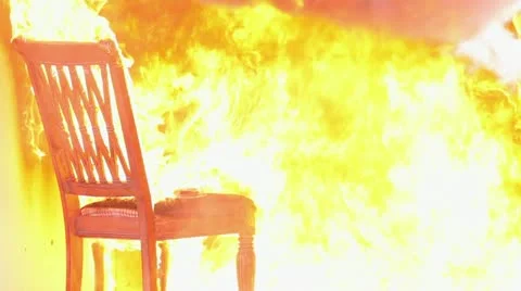 Fireman puts out chair fire Stock Footage 18194504