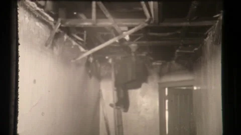 Fireman Puts Out Fire - Firefighter on Ladder Works to Extinguish Blaze Stock Footage 130177346