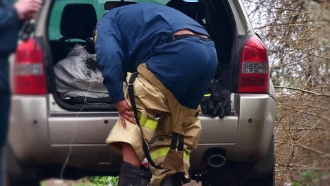 Fireman puts on uniform. Stock Footage 109388705