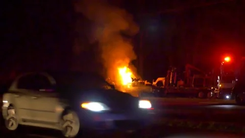 Fireman Putting Out Car Fire Stock Footage 74528150