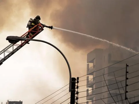 Fireman putting out a fire Stock Photos