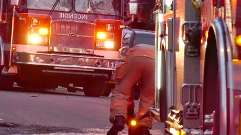 Fireman rolling up hoses Stock Footage 139664291