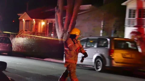 Fireman running at fire during the night Stock Footage 139658763