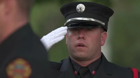 Fireman saluting during 911 ceremony. Stock-Footage 162341192
