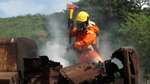 Fireman spray water to the fire burning Stock Footage 105602856