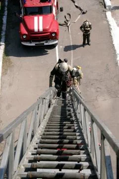 Fireman  on the stairs Stock Photos