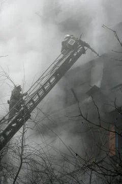 Fireman  on the stairs Stock Photos