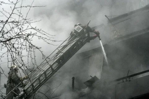 Fireman on the stairs Stock Photos