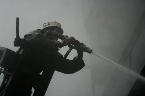 Fireman on the stairs Stock Photos