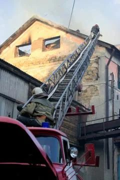 Fireman on the stairs Stock Photos