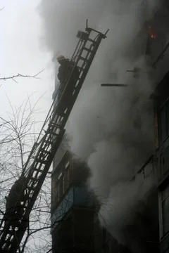 Fireman  on the stairs Stock Photos