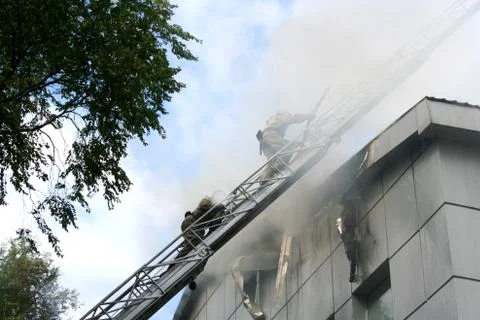 Fireman  on the stairs Фото