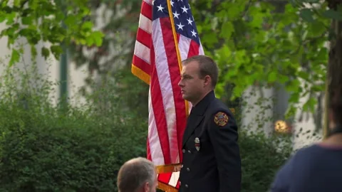 Fireman stand at  attention during 911 ceremony. 動画素材 162761956