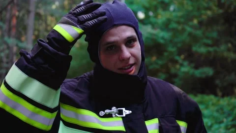 Fireman takes off his uniform 스톡 동영상 136820366