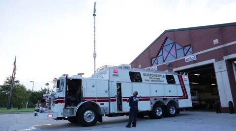 Fireman testing mobile lights on a fire engine Stock Footage 66549108