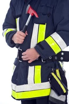 Fireman in uniform with a fire axe Stock Photos