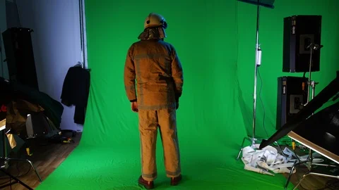 Fireman waiving his hand on the fire (chromakey) Video stock 99184381