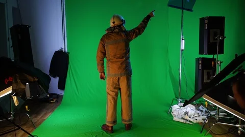 Fireman waiving his hand on the fire (chromakey) Video stock 99184565