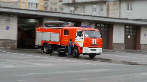 Fireman washes a fire truck Stock Footage 125070545