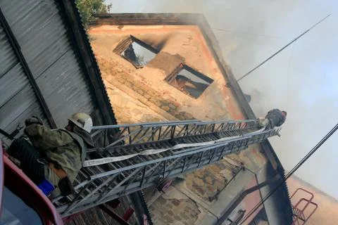 Fireman wearing  on the stairs Stock Photos