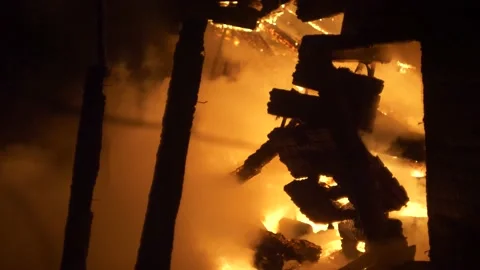 Fireman at work. Burning house. Video stock 221386625
