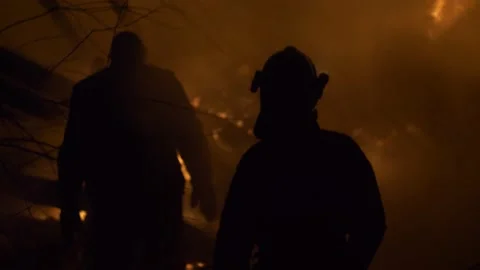 Fireman at work. Burning house. Video stock 221386629