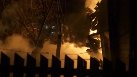 Fireman at work. Burning house. Video stock 221386644