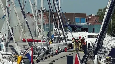 Fireman on work in Marina Volendam Stock Footage 84420841