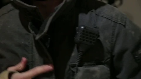 Fireman zipping jacket and exit Stock Footage 77045579