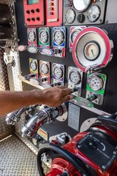 Fireman's hand  pulling valave on a fire engine Stock Photos