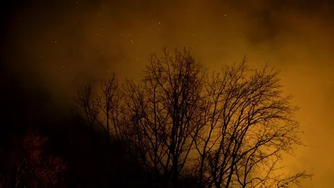 Fireman's trying to control fire in an industrial building during the night. Stock Footage 102644901
