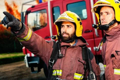Firemen about to take action. Stock Photos